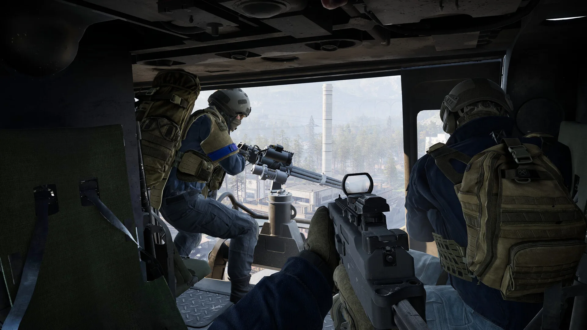 First-person WARDOGS view inside a helicopter with teammates and a mounted weapon.